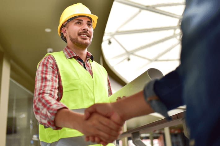 Service Provider and Facility Manager shake hands after successful completing a service request work order to repair an onsite asset.